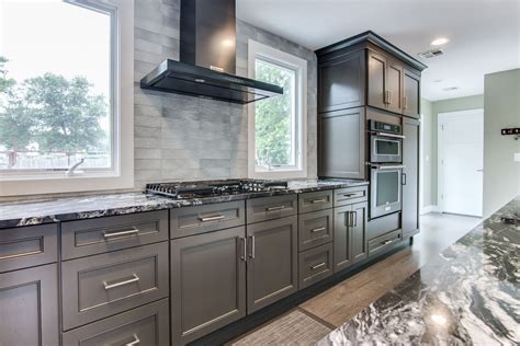 black kitchen cabinets with stainless steel countertops|black kitchen with black countertops.